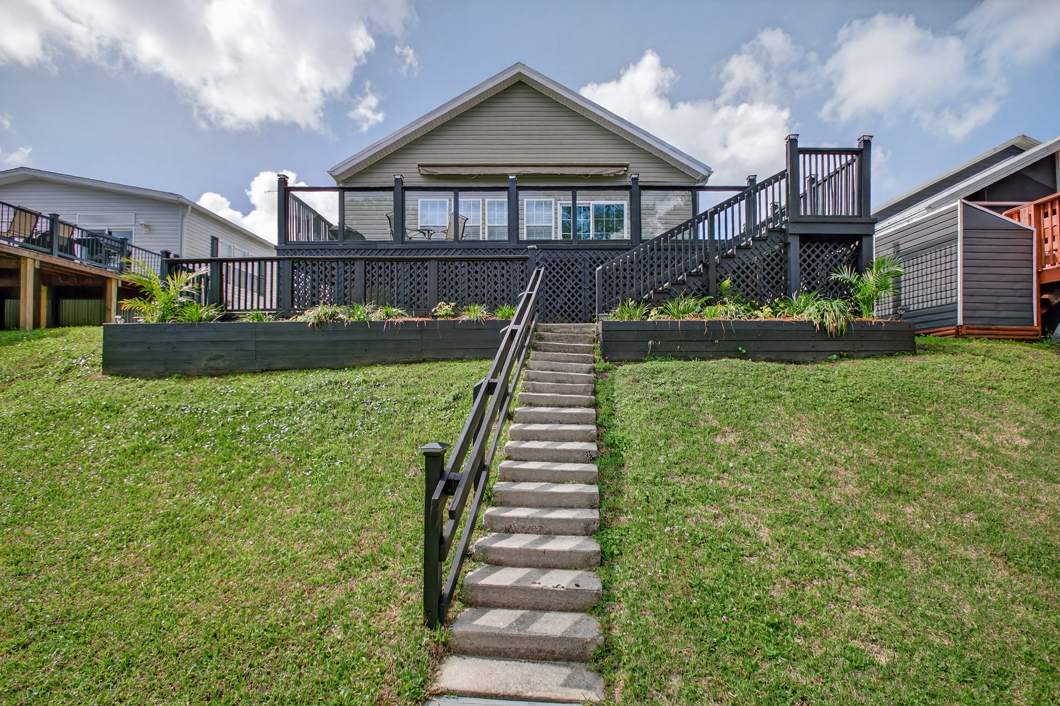 Home on bluff with steps to water